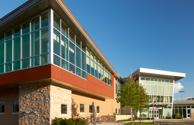 Library building exterior from angle with the reading room and bookdrop in the foreground and the entrance in the background