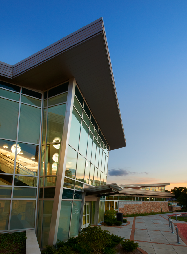 Entrance windows reflecting evening sky and sunset