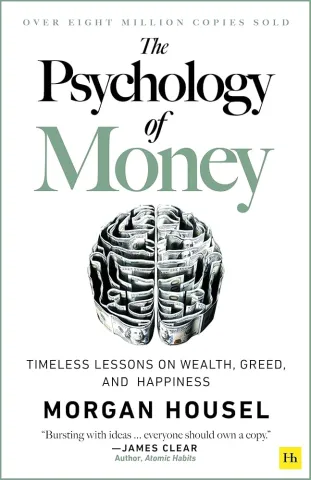 Minimalist book cover with a white background. The title “The Psychology of Money” is centered in bold text, with the word “Money” in orange and the rest in black. Below it, the subtitle reads “Timeless lessons on wealth, greed, and happiness.” The author’s name, Morgan Housel, appears beneath the subtitle in simple black text. The overall design is clean and uncluttered.